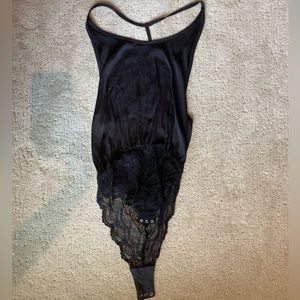 NWOT Free People T back silk black body suit. Size S